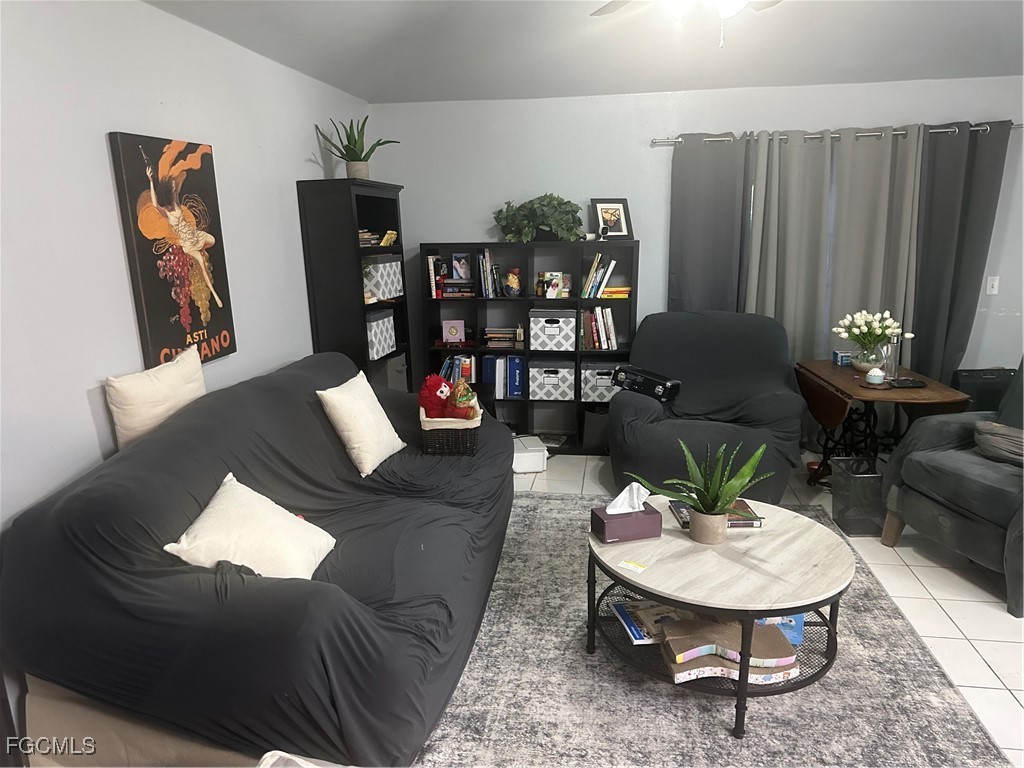 950 Moody Road, Unit 110 North Fort Myers, FL 33903 - Photo 10 of 32 a living room with furniture and wooden floor