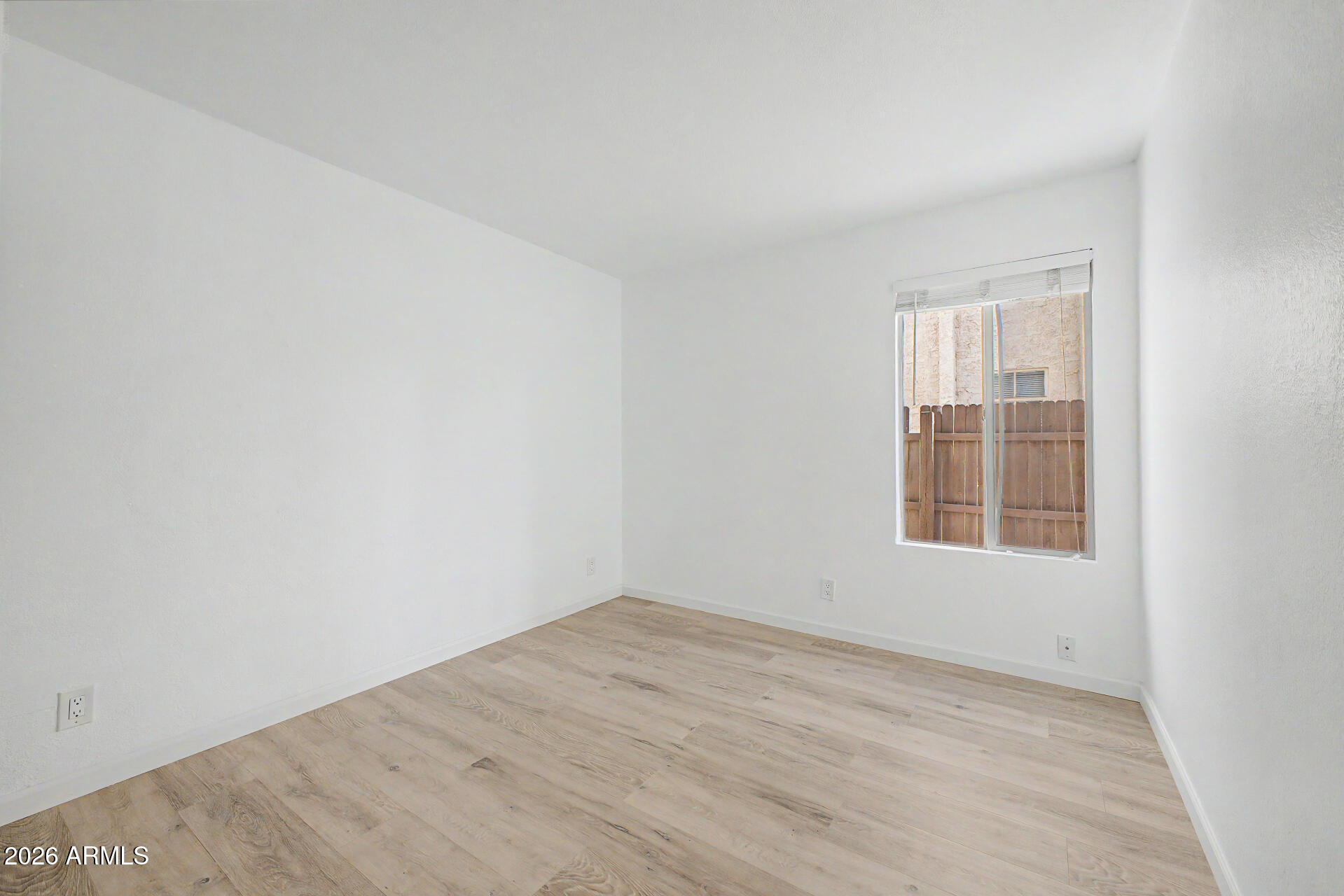 3422 North 12th Place Phoenix, AZ 85014 - Photo 18 of 49 an empty room with a window