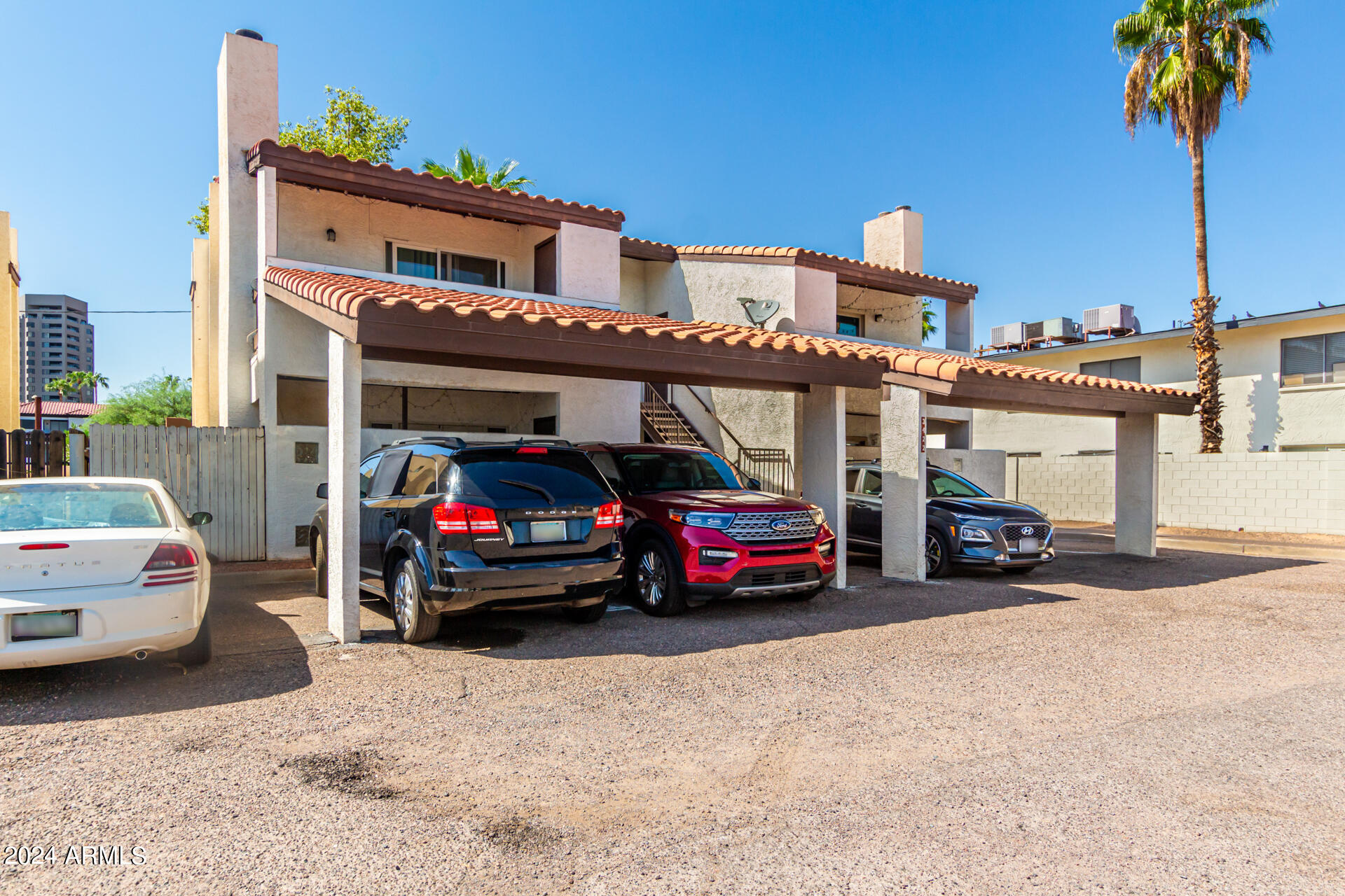 3422 North 12th Place Phoenix, AZ 85014 - Photo 2 of 49 a view of cars parked in front of a house