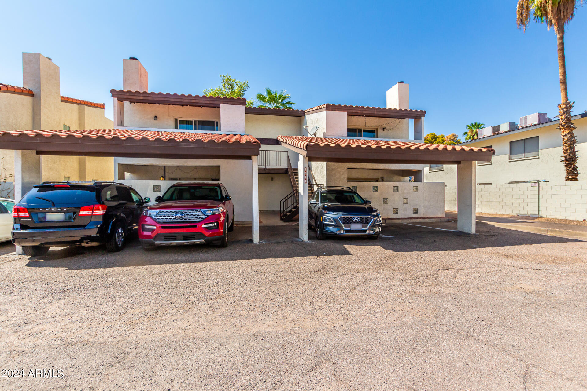 3422 North 12th Place Phoenix, AZ 85014 - Photo 3 of 49 a view of a cars park in front of a building