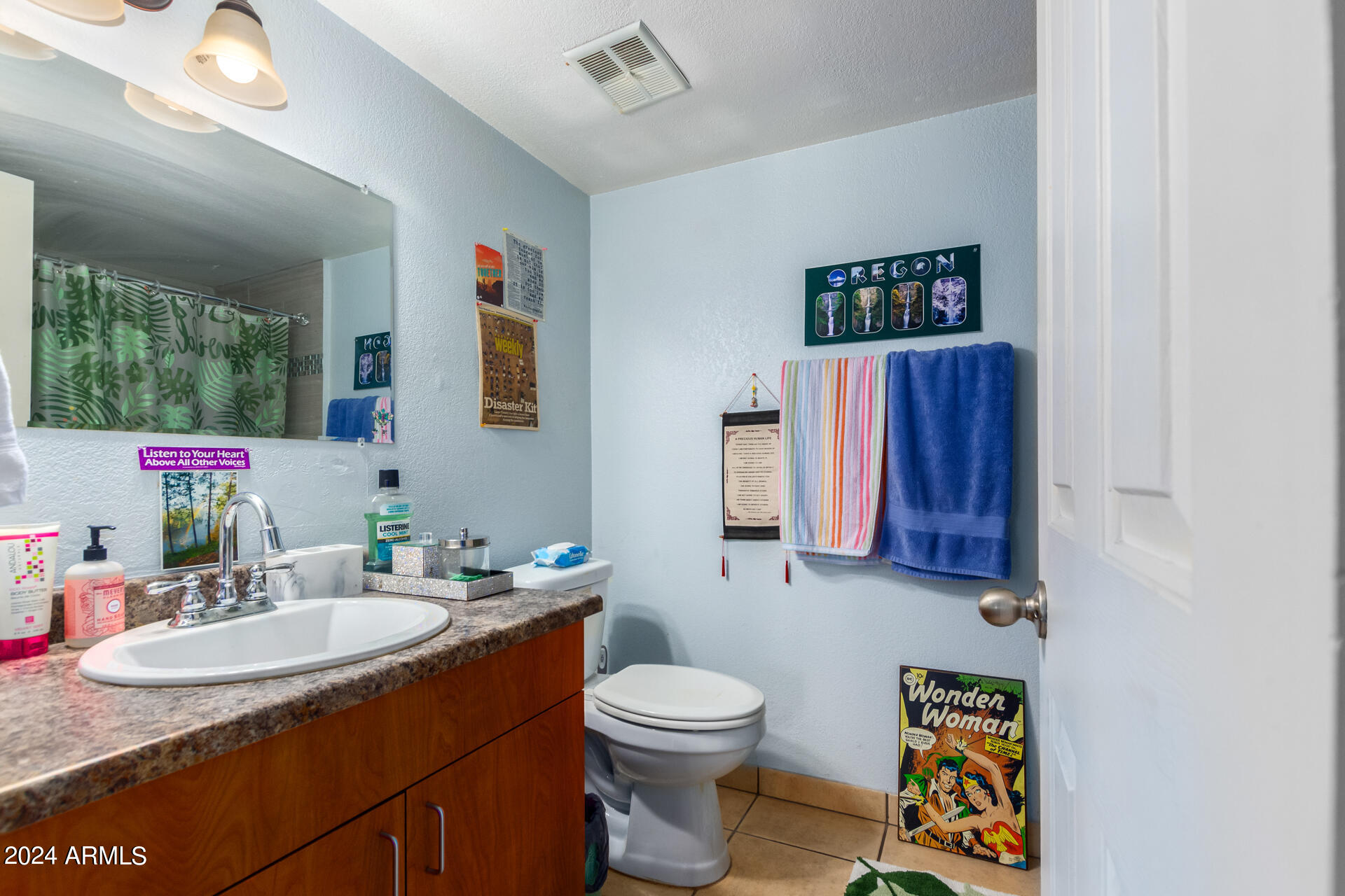 3422 North 12th Place Phoenix, AZ 85014 - Photo 39 of 49 a bathroom with a sink and a mirror