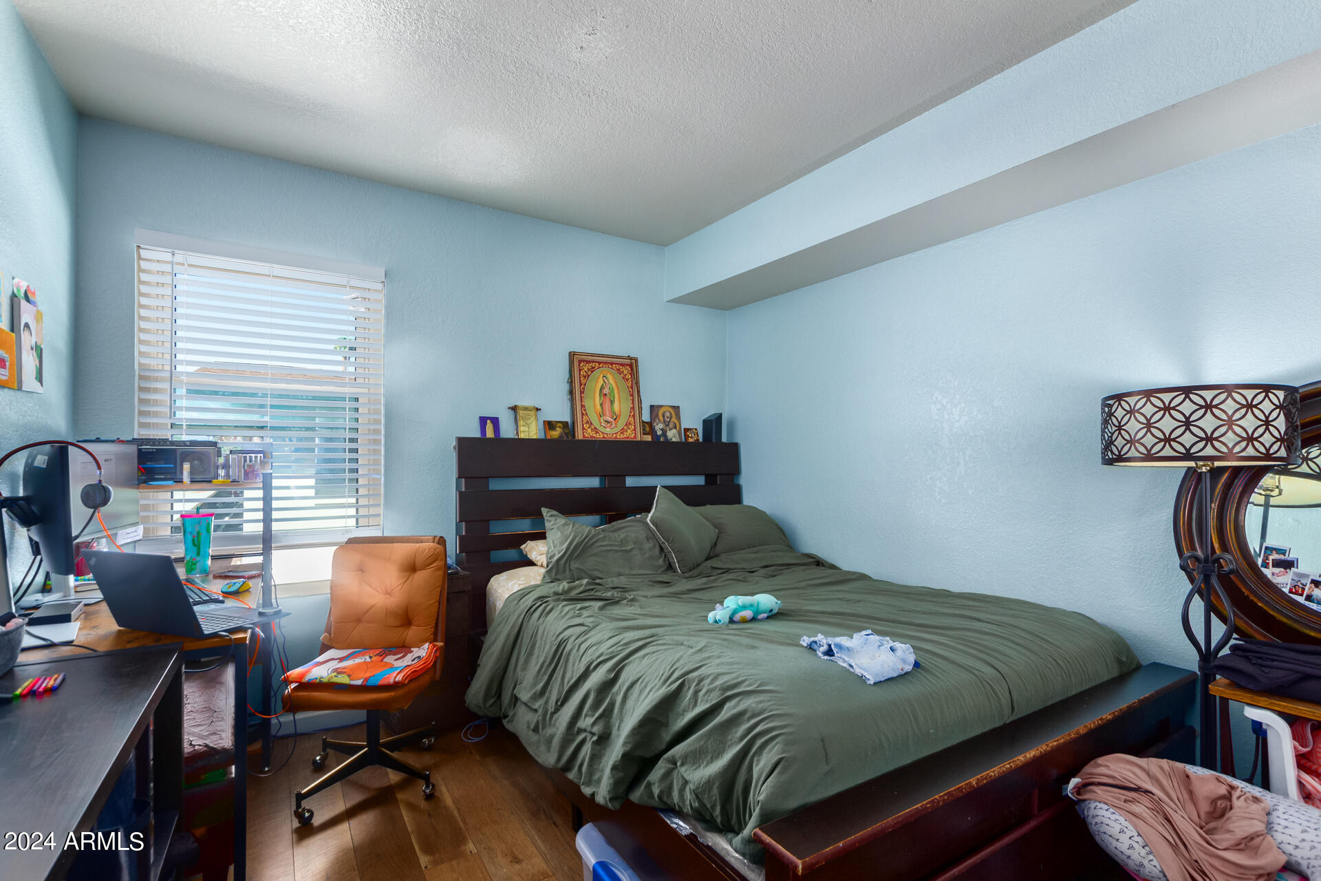 3422 North 12th Place Phoenix, AZ 85014 - Photo 45 of 49 a bedroom with a bed and a desk