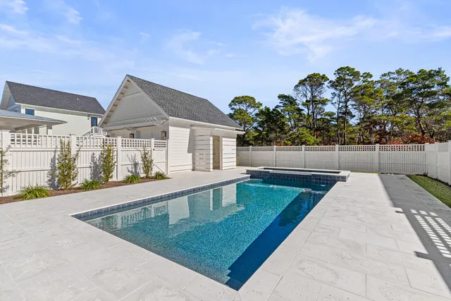 a view of a big yard with a large trees