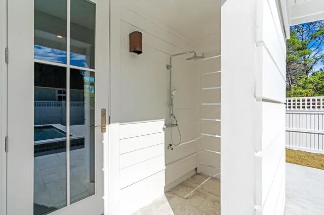 a view of a house with a backyard and a garden