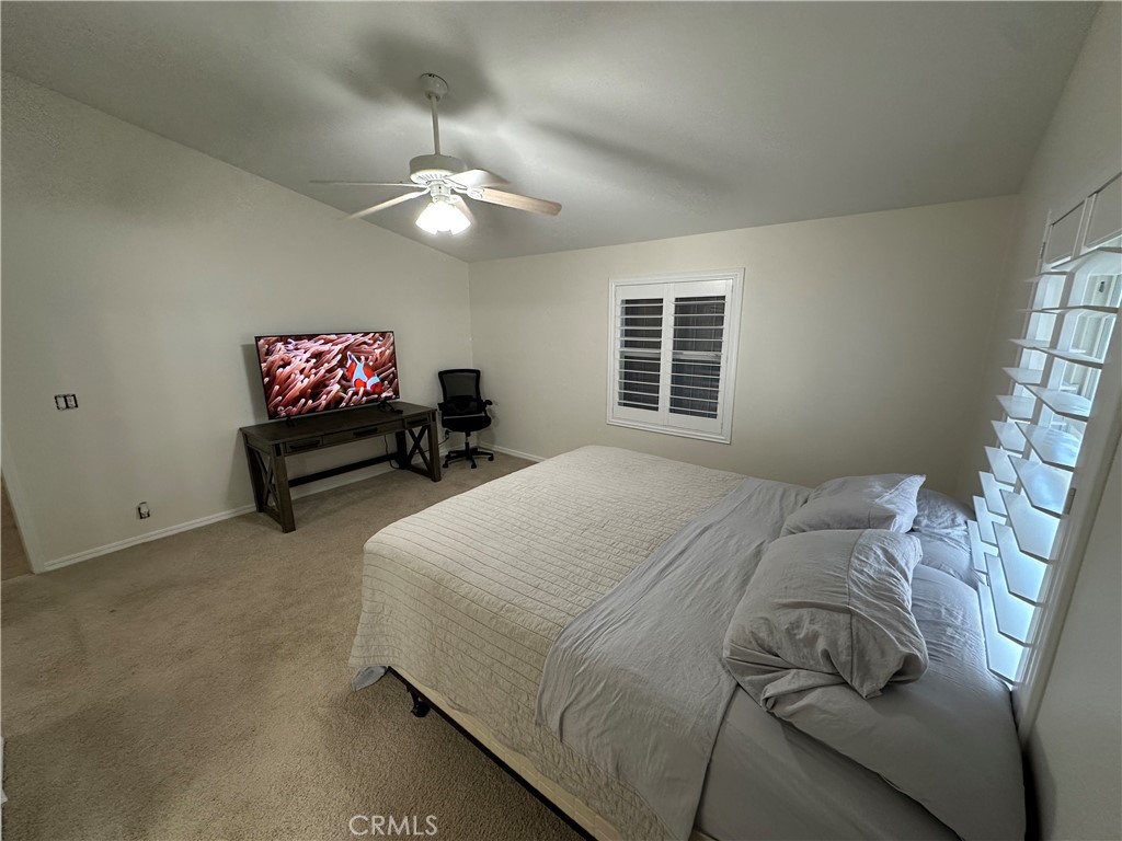 50761 Parker Dam Road, Unit 71 Big River, CA 92242 - Photo 13 of 23 a bedroom with a bed and a chandelier