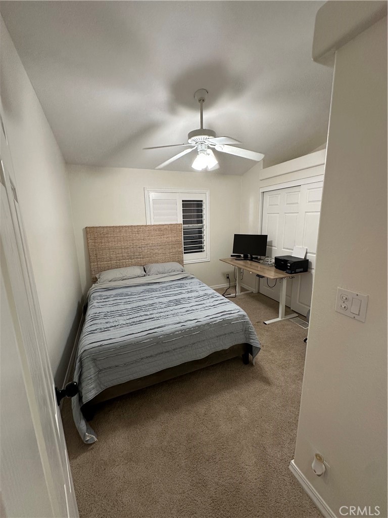 50761 Parker Dam Road, Unit 71 Big River, CA 92242 - Photo 17 of 23 a bedroom with a bed and a chandelier