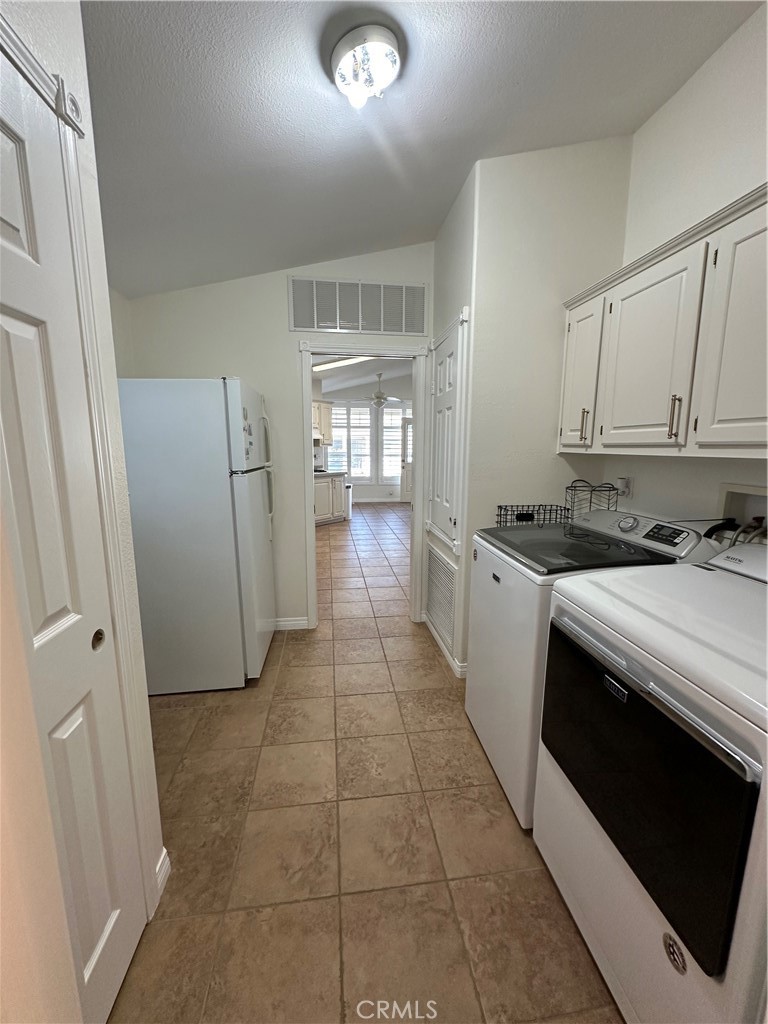 50761 Parker Dam Road, Unit 71 Big River, CA 92242 - Photo 21 of 23 a kitchen with granite countertop a stove a sink and a refrigerator