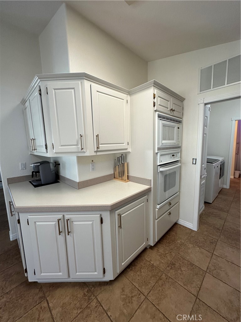 50761 Parker Dam Road, Unit 71 Big River, CA 92242 - Photo 23 of 23 a kitchen with stainless steel appliances a sink and a refrigerator