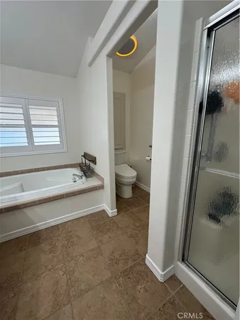 a spacious bathroom with a granite countertop sink and a mirror