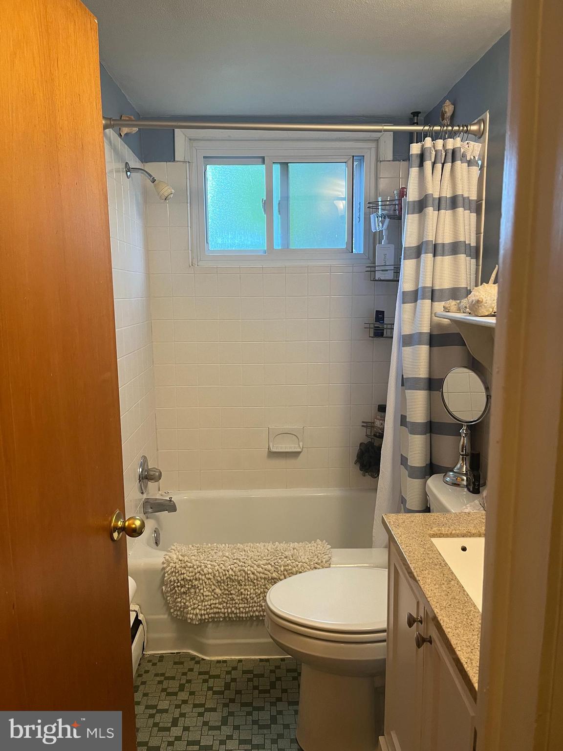 499 Prospect Road Warminster, PA 18974 - Photo 23 of 48 a bathroom with a granite countertop toilet sink and mirror