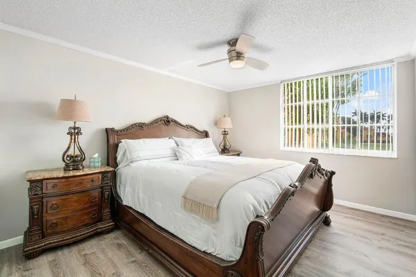 a bedroom with bed and window