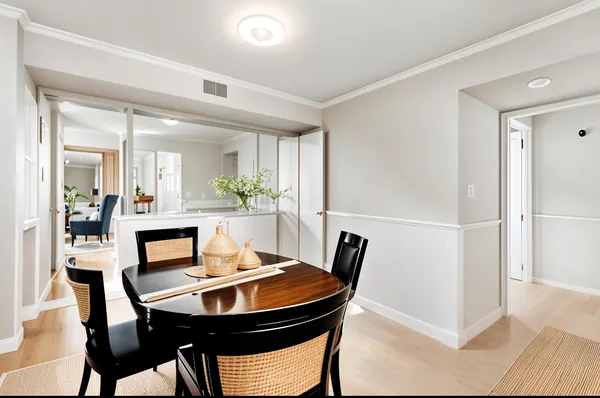 a view of a dining room with furniture and window