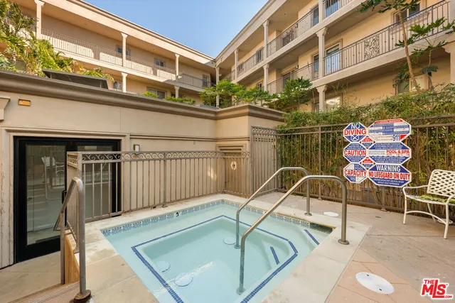 a view of a patio with a table and chairs