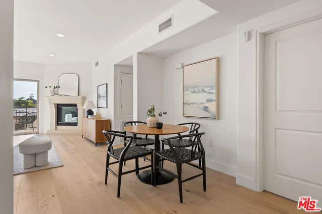 a view of a livingroom with furniture and a fireplace