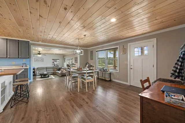 a kitchen with lots of counter top space and wooden floor