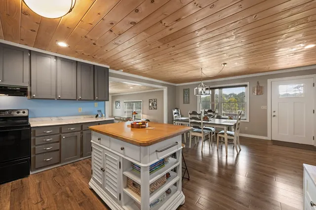 a kitchen with stainless steel appliances a sink stove and refrigerator