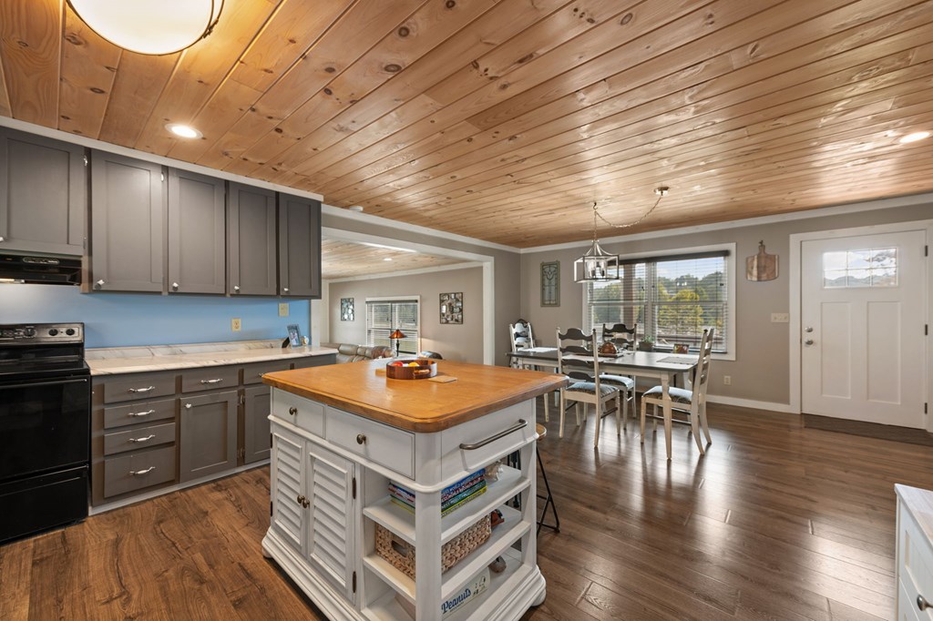 1201 Ada Street Blue Ridge, GA 30513 - Photo 13 of 62 a kitchen with lots of counter top space and wooden floor