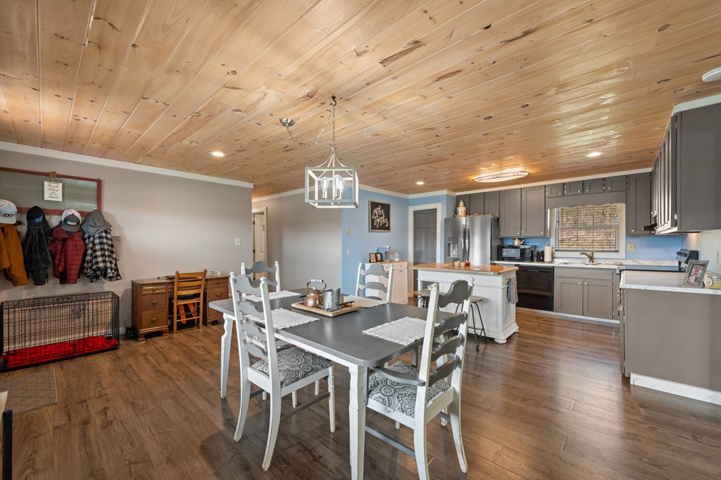 1201 Ada Street Blue Ridge, GA 30513 - Photo 20 of 62 a view of a dining room with furniture and wooden floor