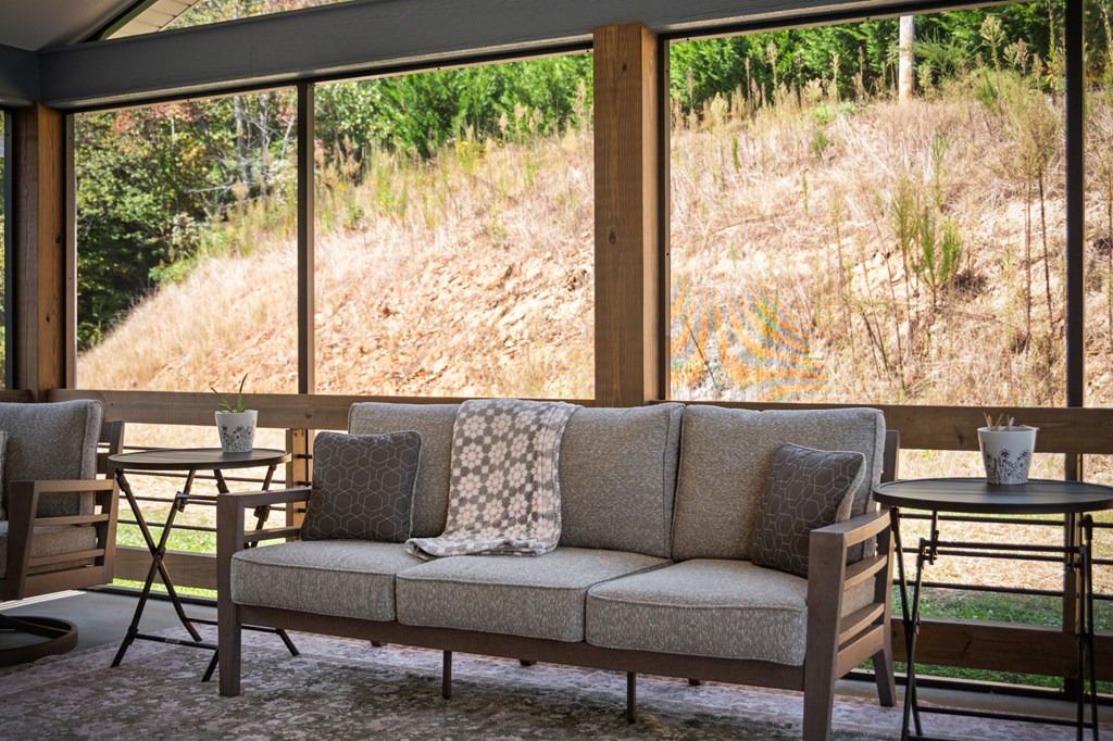 1201 Ada Street Blue Ridge, GA 30513 - Photo 23 of 62 a living room with furniture and a floor to ceiling window
