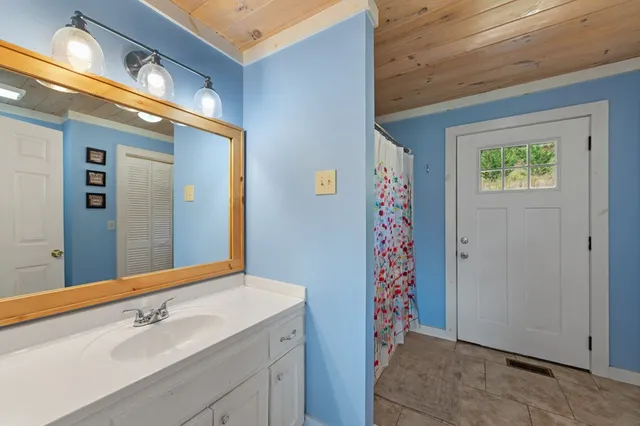 a bedroom with a bed and a tv