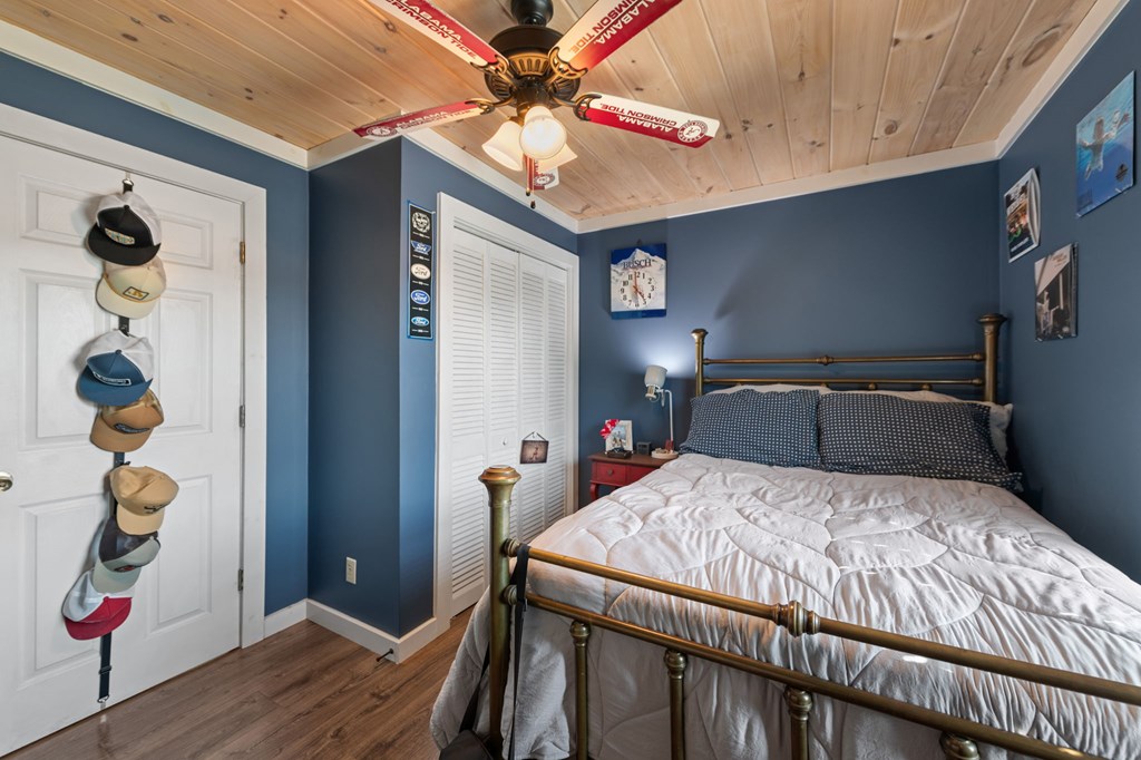 1201 Ada Street Blue Ridge, GA 30513 - Photo 33 of 62 a bedroom with a bed and a chandelier