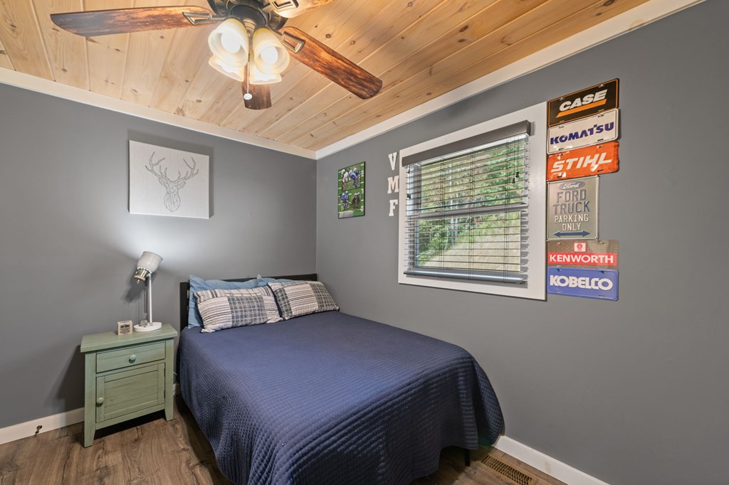 1201 Ada Street Blue Ridge, GA 30513 - Photo 38 of 62 a bedroom with a bed and a window