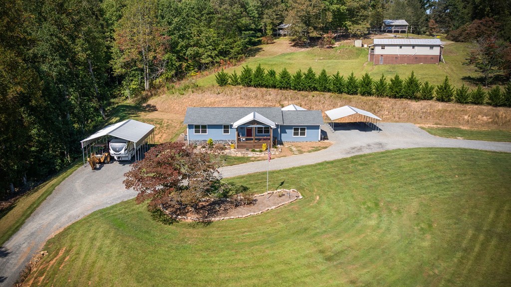 1201 Ada Street Blue Ridge, GA 30513 - Photo 43 of 62 an aerial view of a house with swimming pool and garden