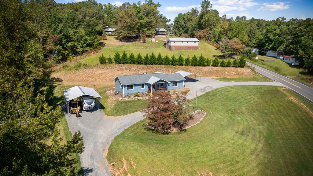 1201 Ada Street Blue Ridge, GA 30513 - Photo 44 of 62 a view of a swimming pool with a yard