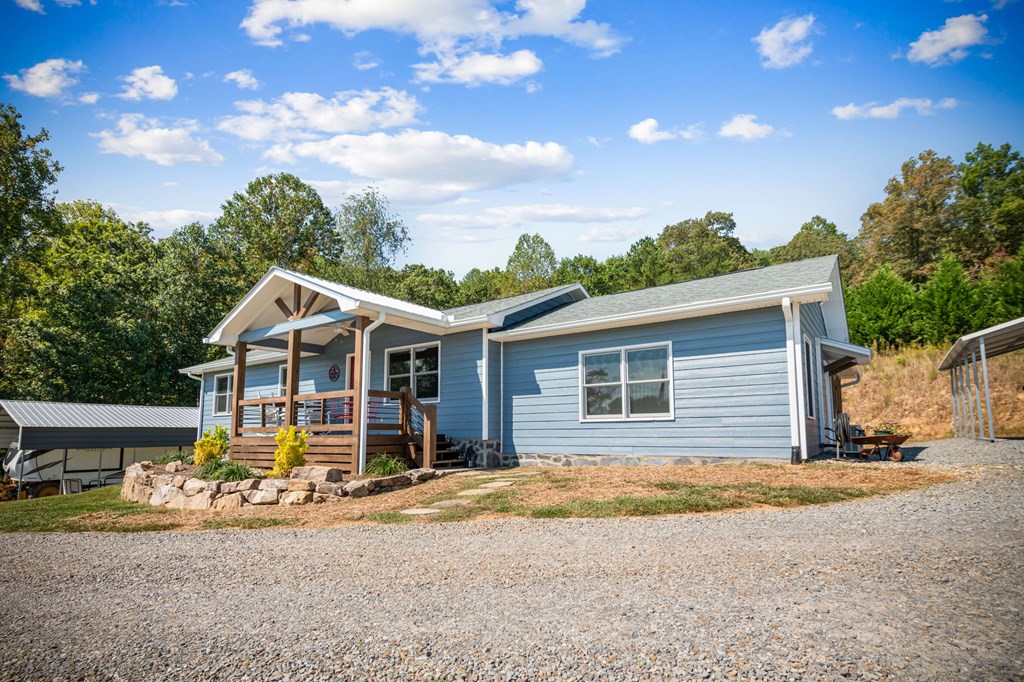 1201 Ada Street Blue Ridge, GA 30513 - Photo 53 of 62 a view of a house with a patio and a yard