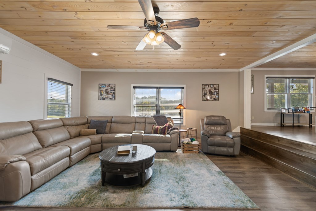1201 Ada Street Blue Ridge, GA 30513 - Photo 6 of 62 a living room with furniture and a chandelier