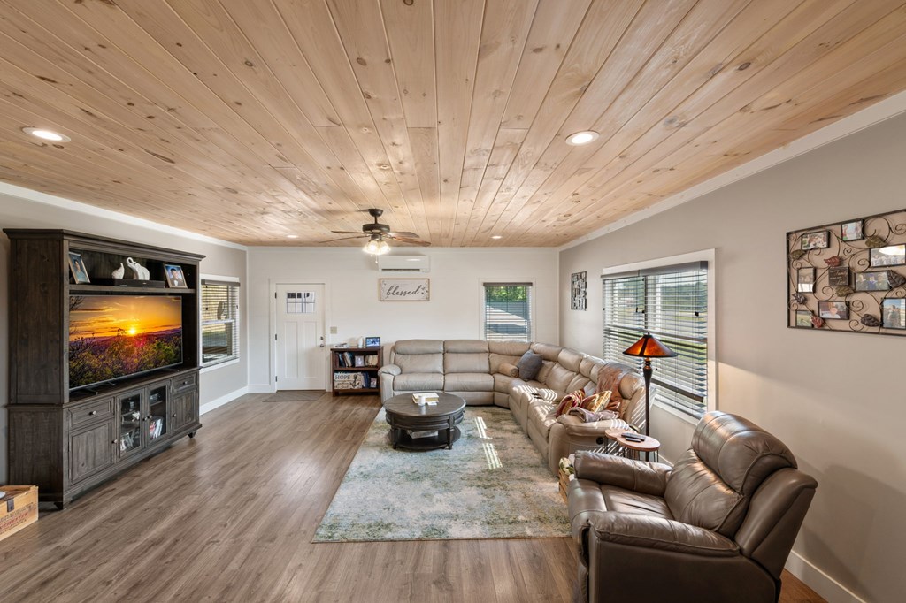 1201 Ada Street Blue Ridge, GA 30513 - Photo 7 of 62 a living room with furniture and a flat screen tv