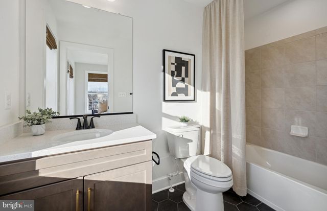 a bathroom with a sink a toilet and a bathtub