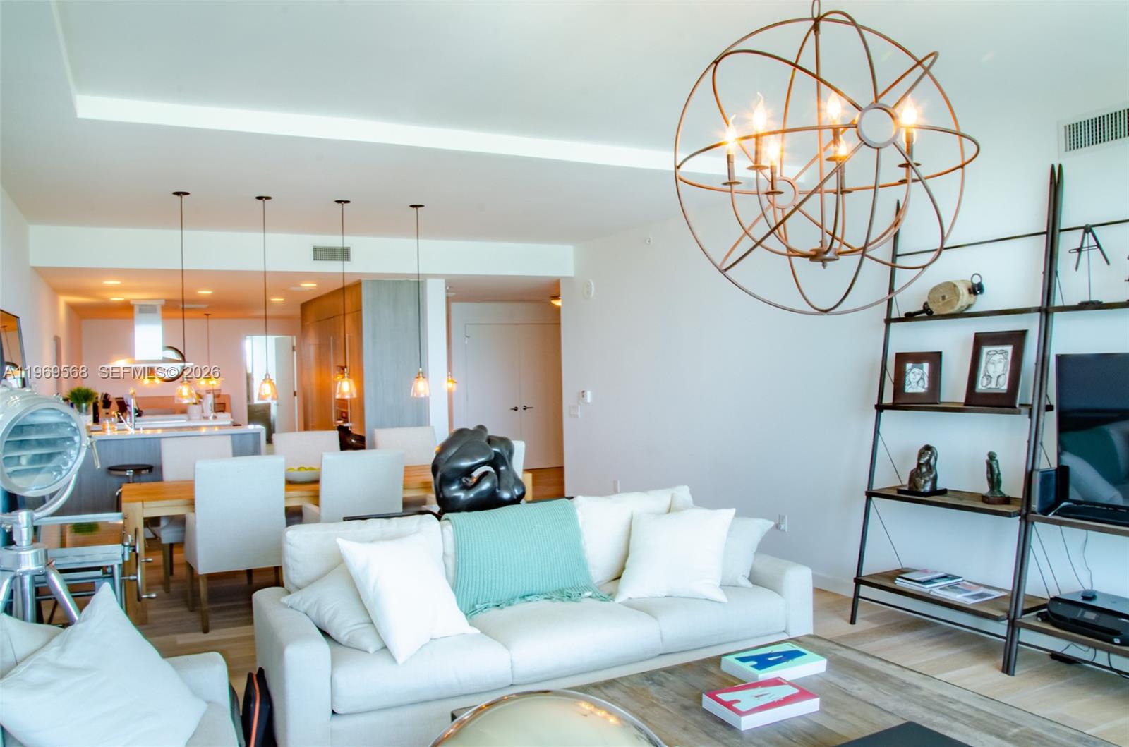 350 Ocean Drive, Unit 406N Key Biscayne, FL 33149 - Photo 11 of 41 a living room with furniture and a chandelier