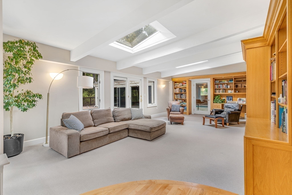 46 Round Hill Road Lincoln, MA 01773 - Photo 12 of 42 a living room with furniture and a large window