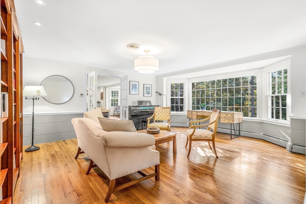 46 Round Hill Road Lincoln, MA 01773 - Photo 15 of 42 a living room with fireplace furniture and a large window