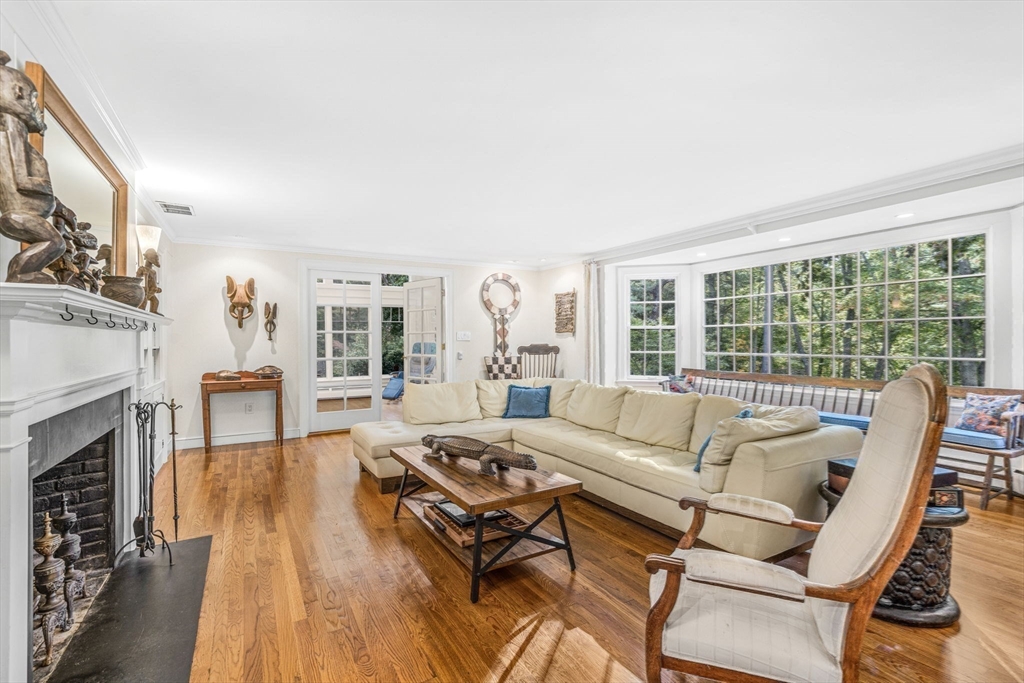 46 Round Hill Road Lincoln, MA 01773 - Photo 16 of 42 a living room with furniture and a fireplace