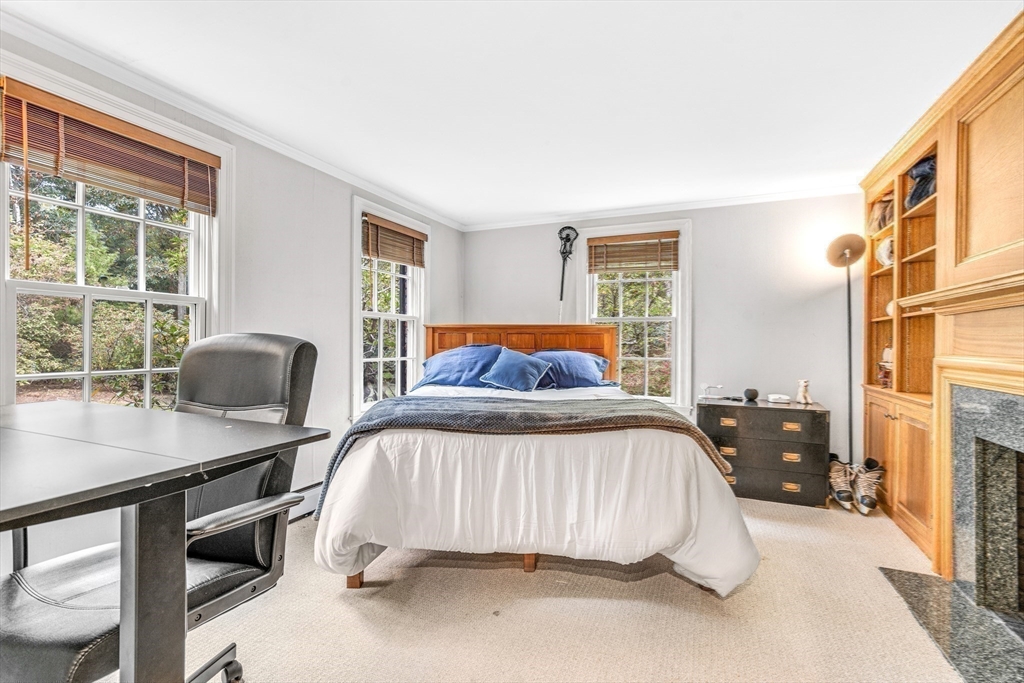 46 Round Hill Road Lincoln, MA 01773 - Photo 18 of 42 a bedroom with a bed and wooden floor