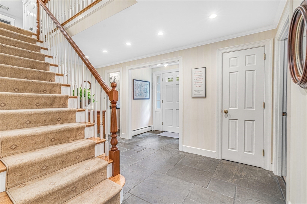 46 Round Hill Road Lincoln, MA 01773 - Photo 20 of 42 a view of entryway with wooden floor and stairs