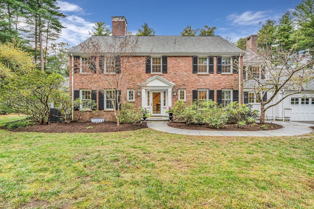 46 Round Hill Road Lincoln, MA 01773 - Photo 2 of 42 a front view of a house with a yard