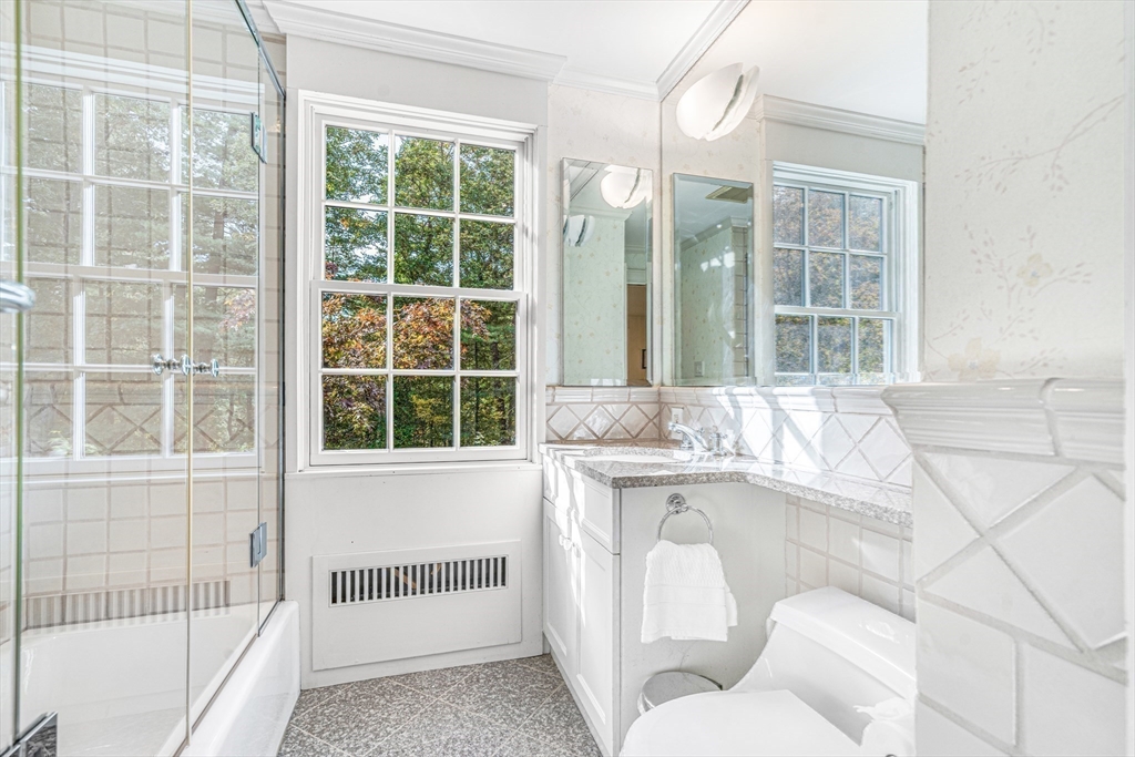 46 Round Hill Road Lincoln, MA 01773 - Photo 22 of 42 a living room with a couch and a large window