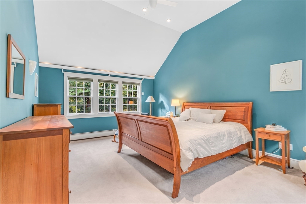 46 Round Hill Road Lincoln, MA 01773 - Photo 27 of 42 a bedroom with a bed and a table in it