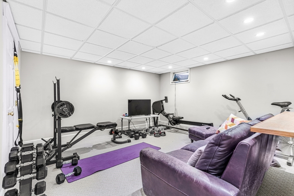 46 Round Hill Road Lincoln, MA 01773 - Photo 29 of 42 a living room with furniture and a flat screen tv