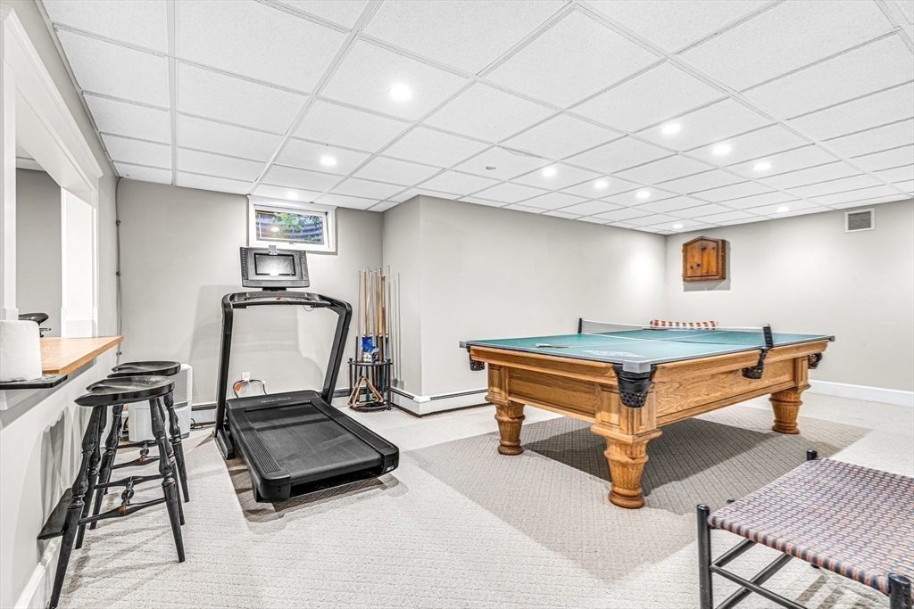 46 Round Hill Road Lincoln, MA 01773 - Photo 30 of 42 a living room with furniture a piano and wooden floor