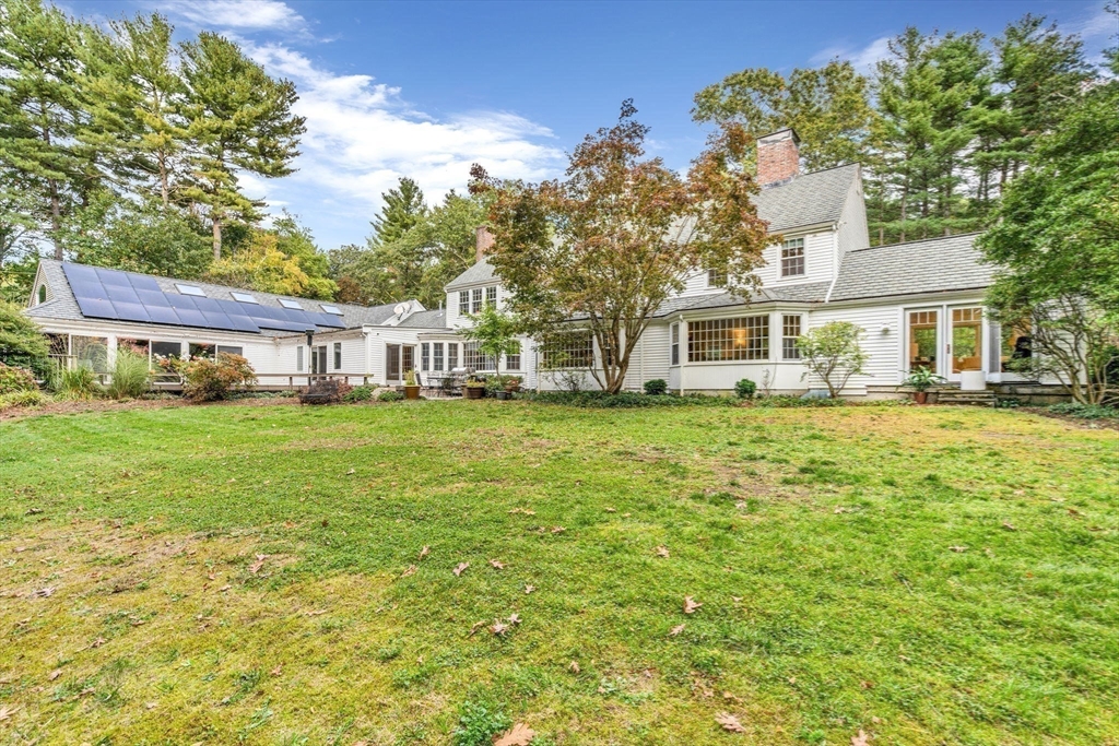 46 Round Hill Road Lincoln, MA 01773 - Photo 33 of 42 a front view of a house with garden