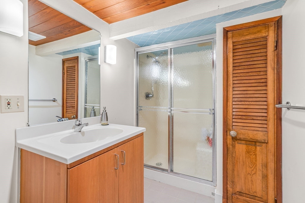 46 Round Hill Road Lincoln, MA 01773 - Photo 36 of 42 a bathroom with a sink and a mirror