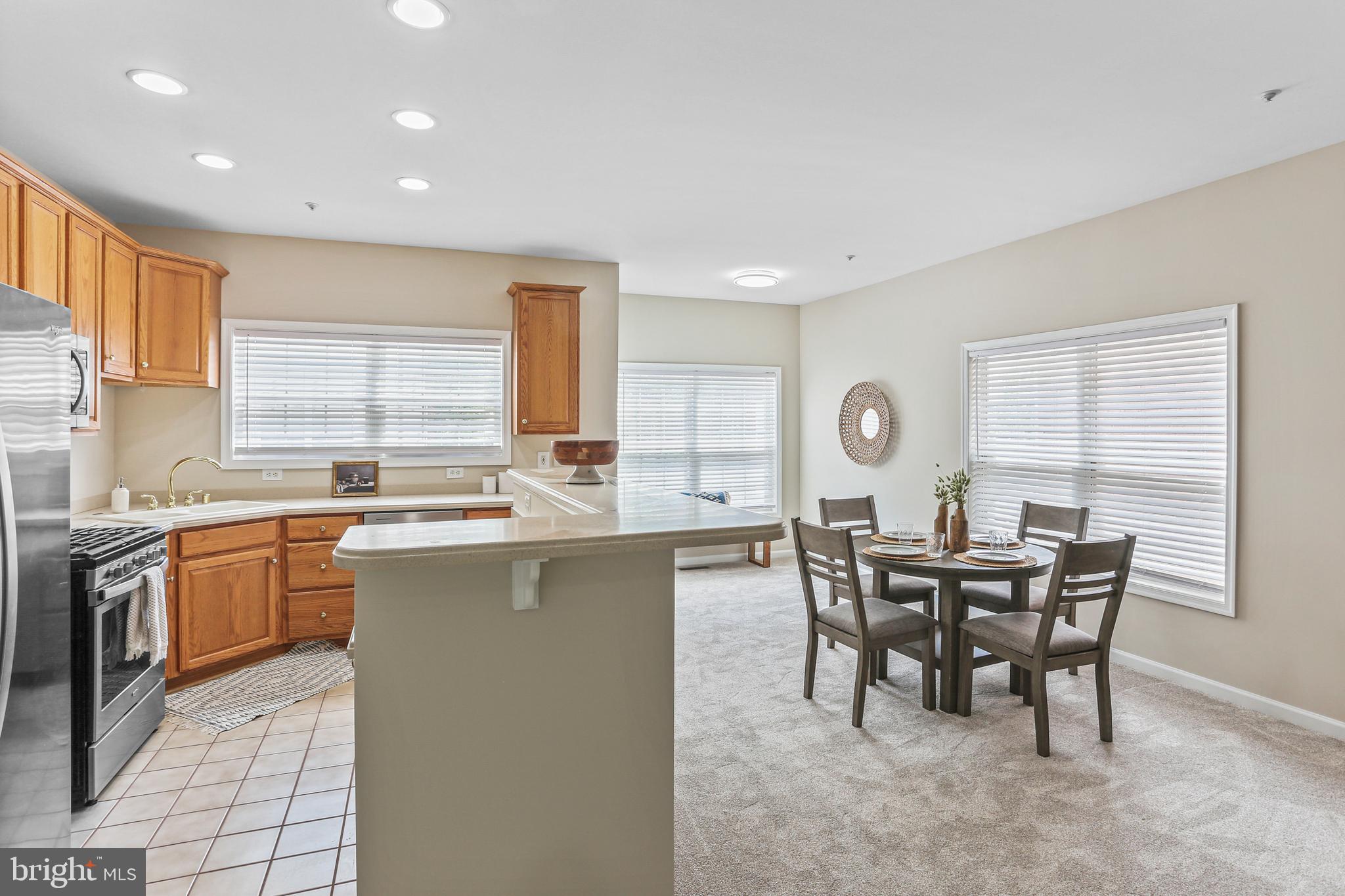 10232 Rutland Round Road, Unit 24 Columbia, MD 21044 - Photo 11 of 31 a view of a dining room with furniture and window