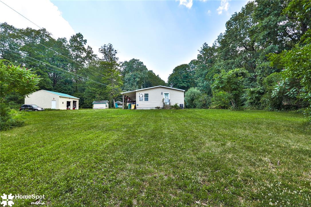 3795 Rhoades Road Kempton, PA 19529 - Photo 35 of 42 A quaint residential dwelling surrounded by flourishing greenery and ample yard space.