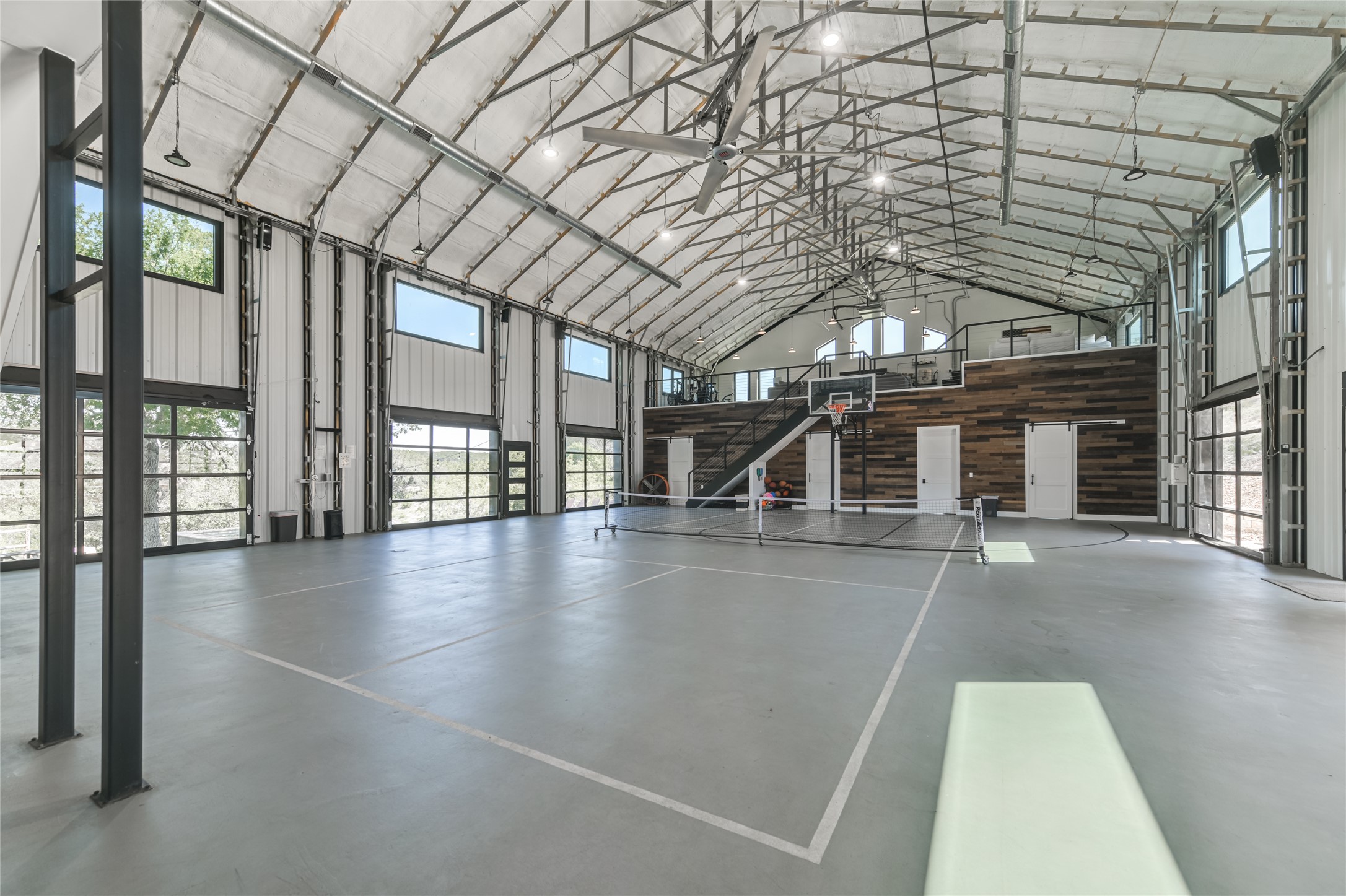 0 Trails End Road Leander, TX 78641 - Photo 12 of 40 an empty room with wooden floor and windows