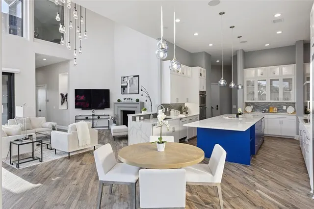 a large kitchen with a table and chairs