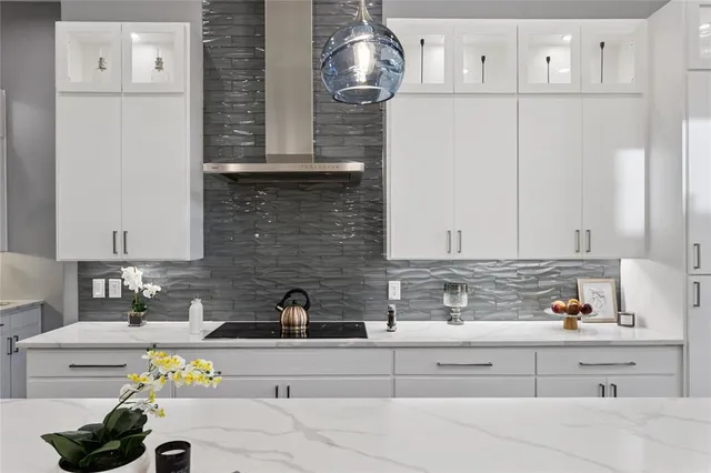 a kitchen with stainless steel appliances granite countertop a sink and cabinets